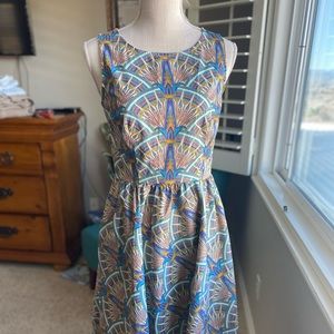 Cutest dress with peacock like print POCKETS!!